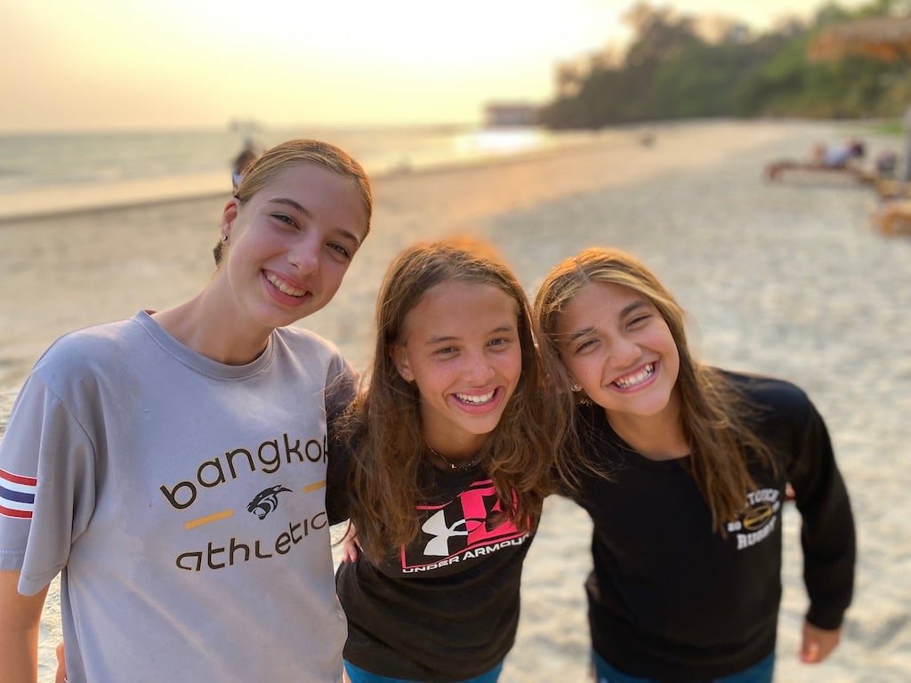 friends smiling on beach